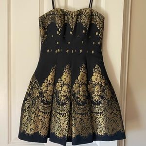 Black and gold mini dress